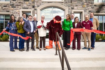 Virginia Tech and Blacksburg town officials cut the ribbon on the front steps of the new Transit Center