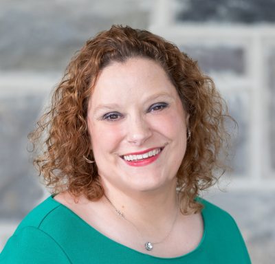 image of Katie Smith in front of Hokie Stone wall