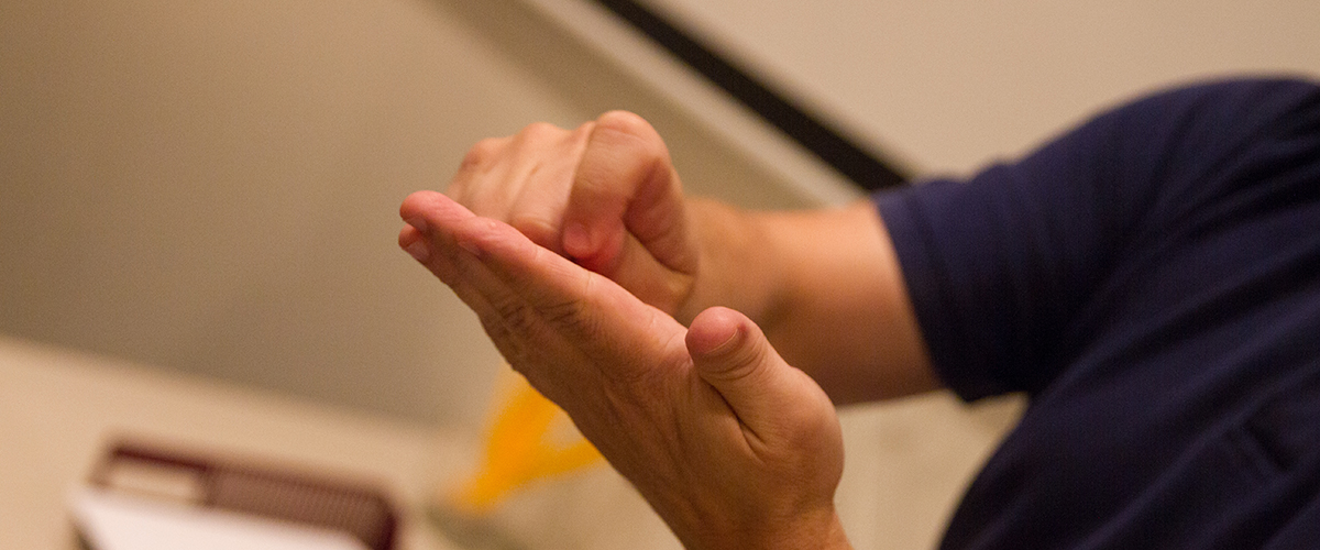 a close up of an interpreters hands