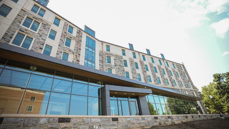 Creativity and Innovation District Residence Hall limestone Hokie Stone exterior with 10 foot glass windows.